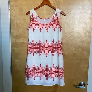 Red and white patterned shift dress.